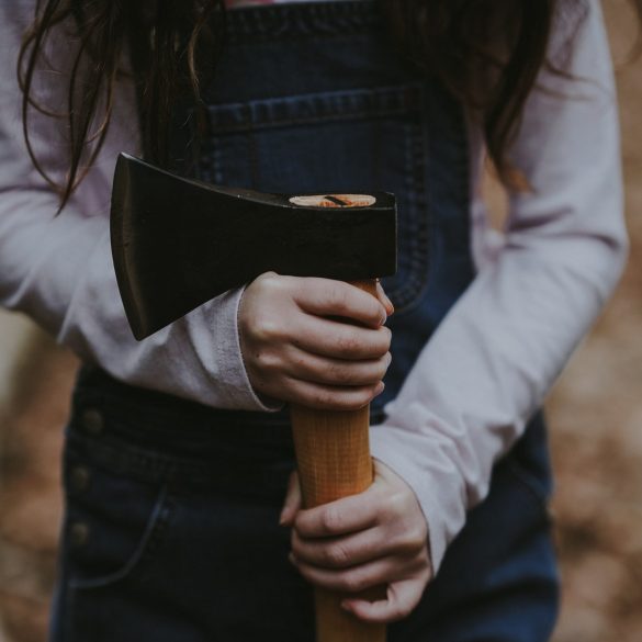 Lumberjack throwing axe
