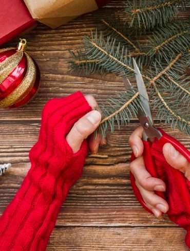 woman-cutting-fir-tree-branch-750