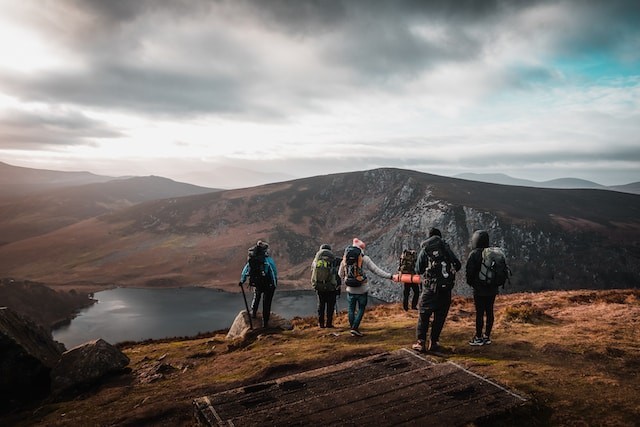 persons hiking in mountains