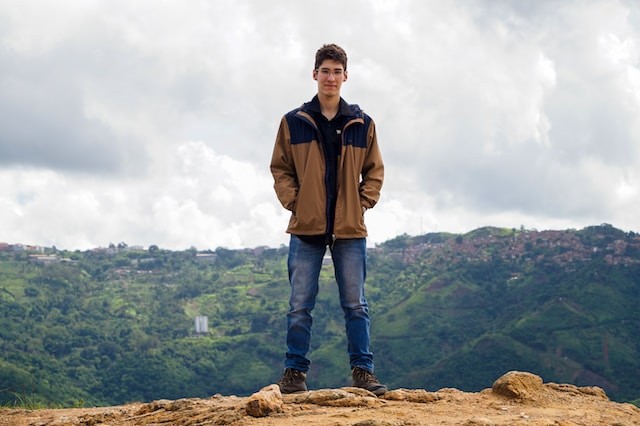 person in jacket in mountains